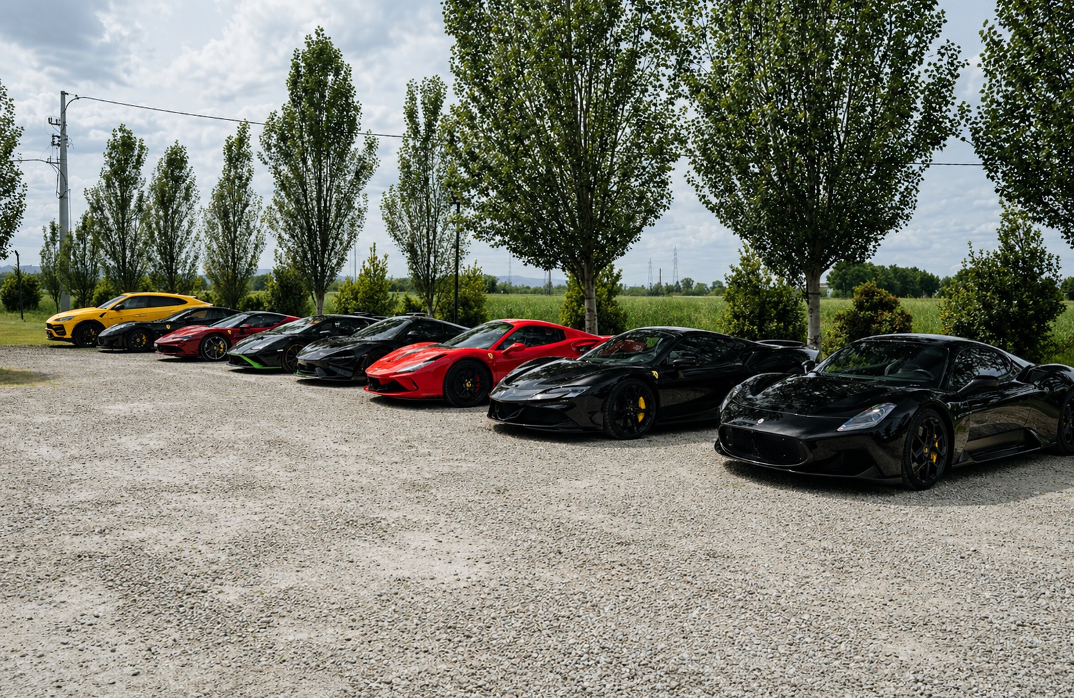 Supercar lineup on the gravel area in Tuscany